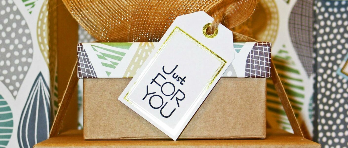 close up photo of gift boxes with greeting card